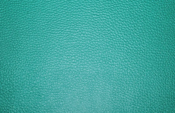 Texture colored leatherette green, for design and upholstery for decoration and fashion, for the background and tukstur