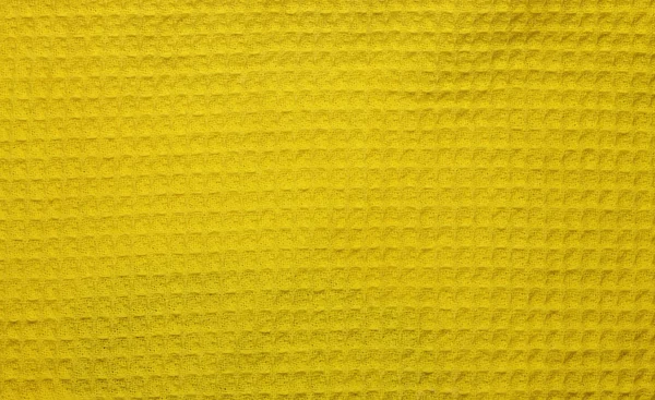 Tessuto di cotone waffle texture sfondo giallo astratto backgrou — Foto Stock