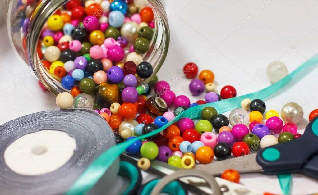 colorful beads, ribbons andother sewing supplies for sewing and 