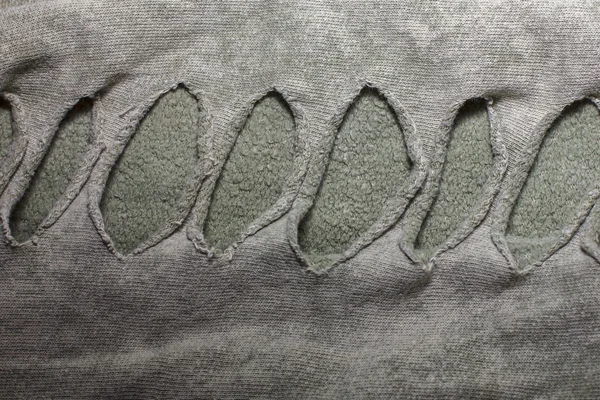 Katoen stof textuur met sleuven met gaatjes voor de achtergrond een — Stockfoto