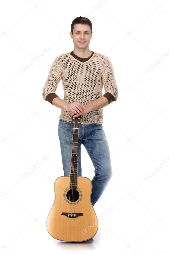 Handsome young man musician with guitar