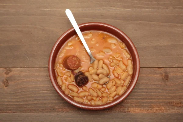 Asturian bean stew in a clay pot.