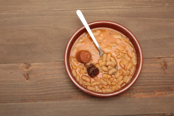 Asturian bean stew in a clay pot.