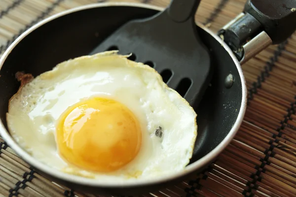 Fried egg in a small pan — Stock Photo, Image