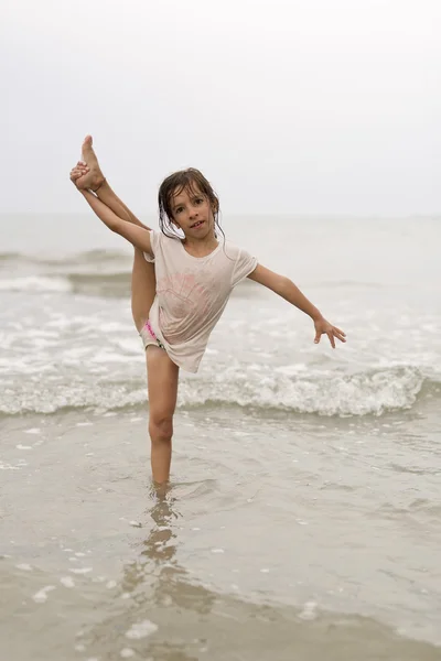 Girl in the water of a beach