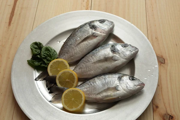 raw fish silver tray
