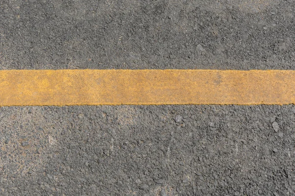 Yellow line dirty on black asphalt road texture — Stock Photo, Image