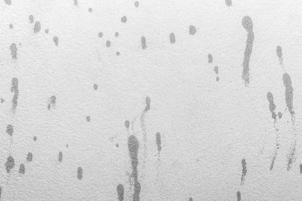 White concrete background cement textured with printer ink splas