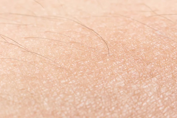 Textura da pele humana com cabelos pretos foco suave na pele para h — Fotografia de Stock