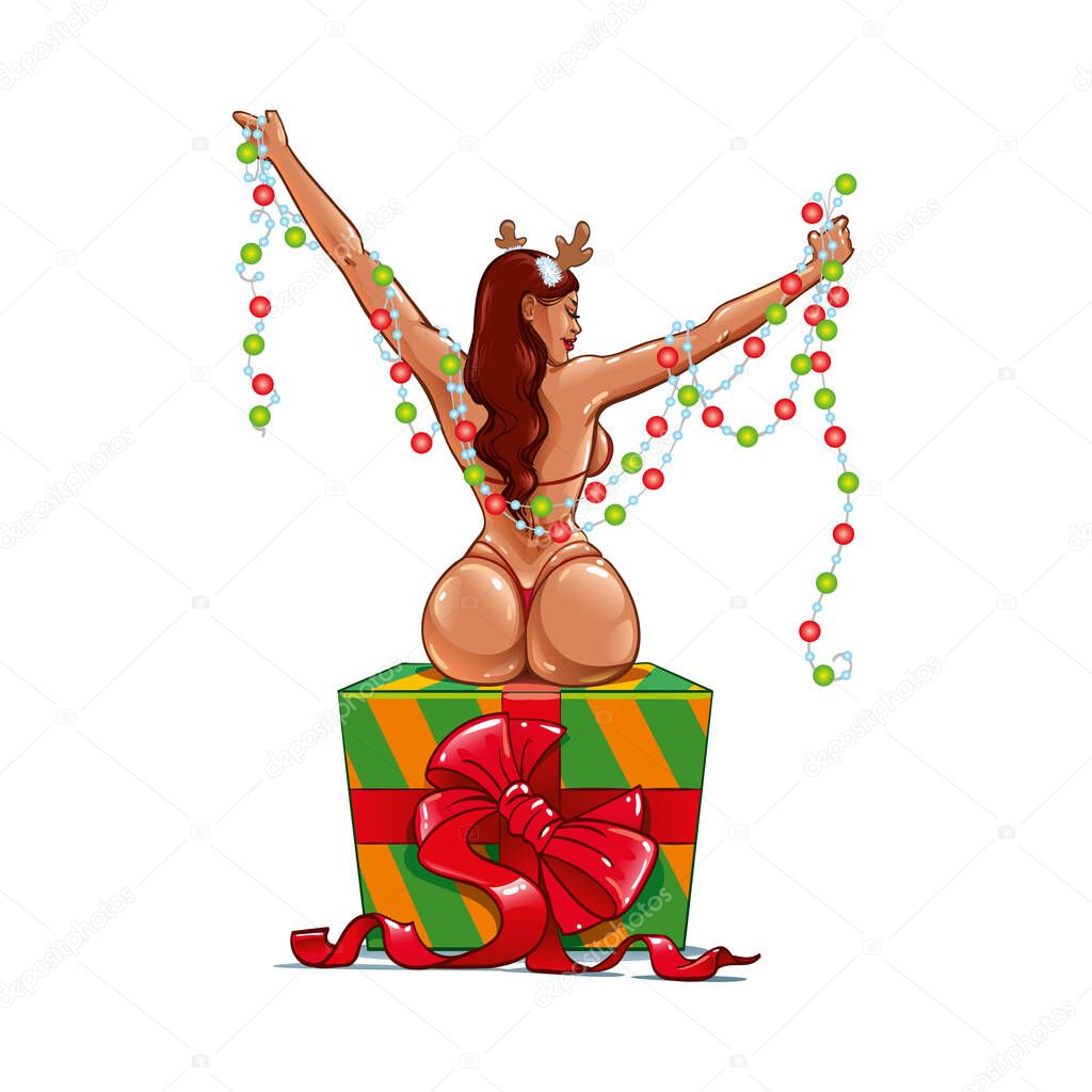 Sexy girl with a big booty and wide hips in a New Year's Eve Costume with deer horns on her head and wrapped in a Garland Lights like a Christmas tree. Woman in a bikini sits on a gift box with a bow 