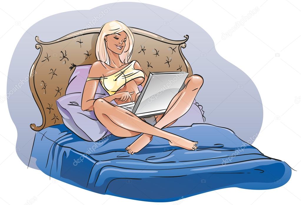 Girl with a laptop sitting in bed