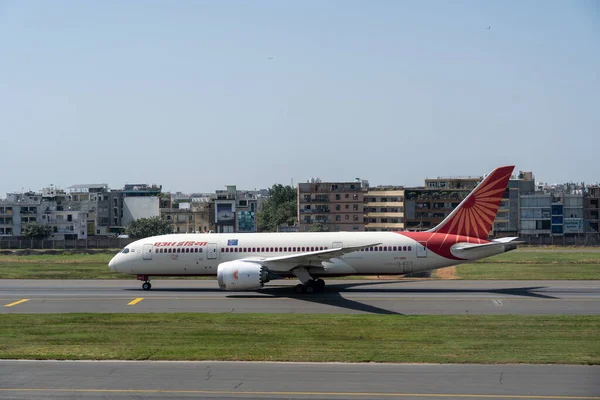 Air India Boeing 787 Dreamliner parked at an international airport terminal