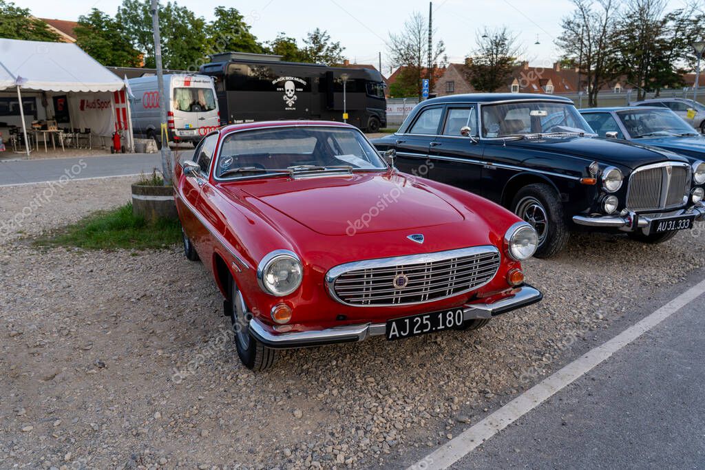 Copenhagen, Denmark - August 02, 2024: A red Volvo 1800 S vintage car at the Copenhagen Historic Grand Prix