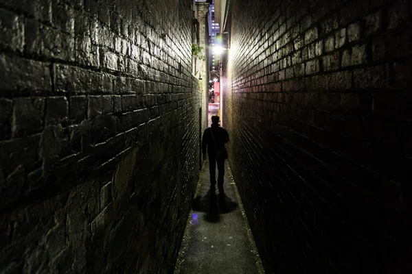 Man silhouette in alleyway — Stock Photo, Image