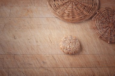 oatmeal cookies on a wooden cutting board with space for writing