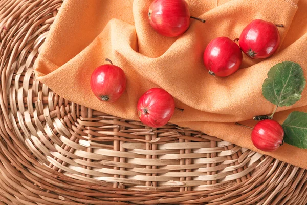 Autumn small apples in a wicker basket a place for an inscription — Stock Photo, Image