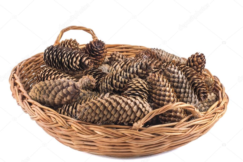 fir cones in a wicker wicker basket