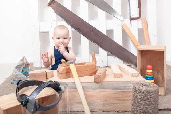 The small child with a plane Carpenter — Stock Photo, Image