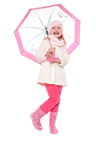 Little cute girl with an umbrella in the colorful dress isolated on white background space for inscriptions — Stock Fotó