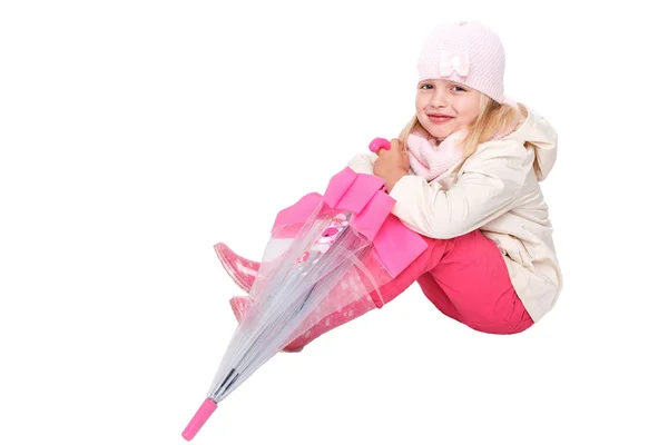 Little cute girl with an umbrella in the colorful dress isolated on white background space for inscriptions — Stock fotografie