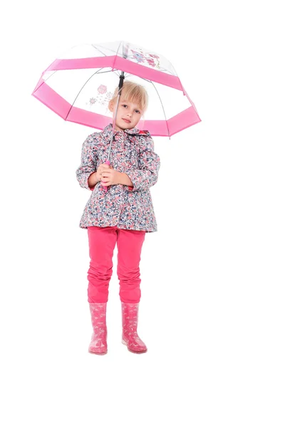 Little cute girl with an umbrella in the colorful dress isolated on white background space for inscriptions — Stock fotografie