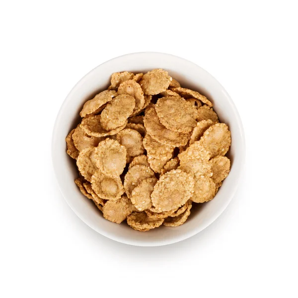 Multigrain flakes in small white plate, isolated. — Stock Photo, Image