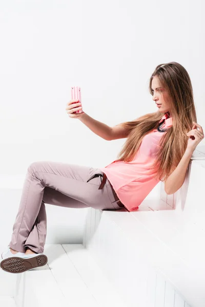 girl doing selfie on mobile phone