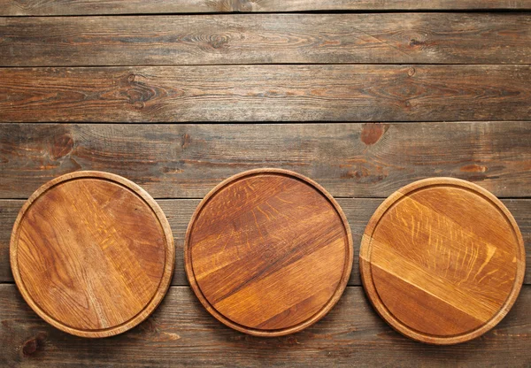 Empty wooden pizza plates with copy space