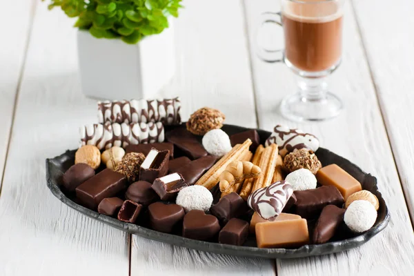 Delicious plate with sweets on table — Stock Photo, Image