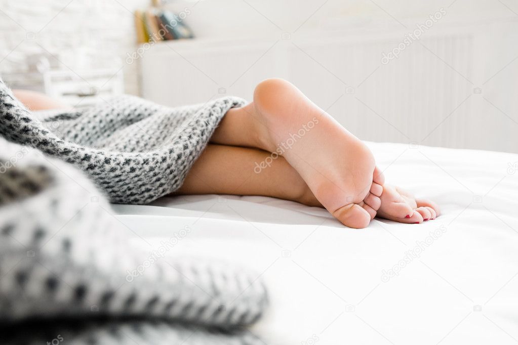 Sleeping woman naked heels on the bed