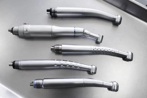 Set of dental handpieces without burs flat lay