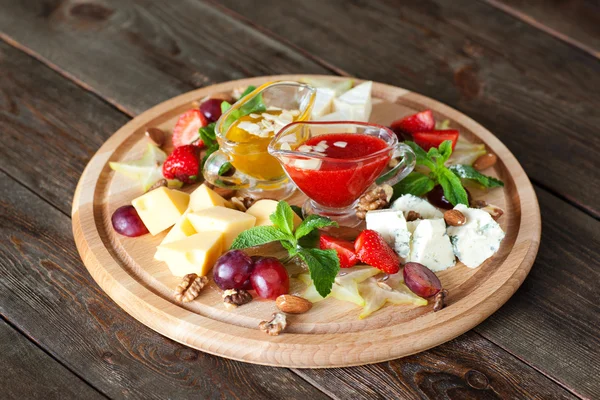 Fruits and cheese oh catering platter top view