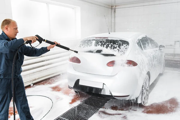 Handle carwash concept, man with hose wash car — Stock Photo, Image