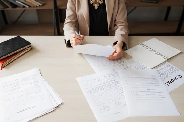 Unrecognizable woman reading document, free space