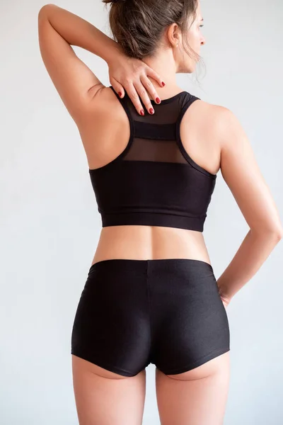 Woman sportswear clothing branding buttocks shorts — Stock fotografie