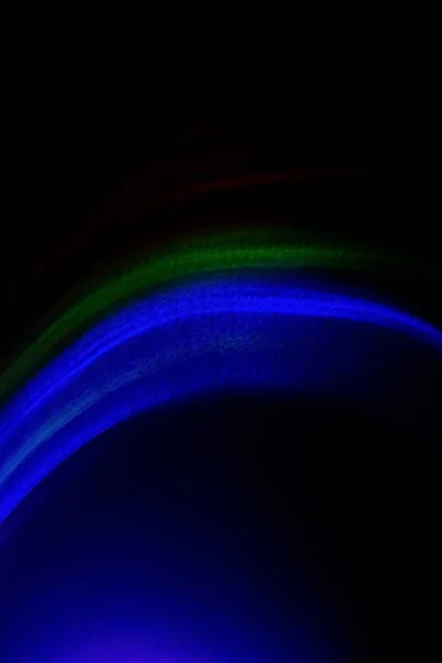 Neon light background colorful rays defocused blue — Stock Photo, Image