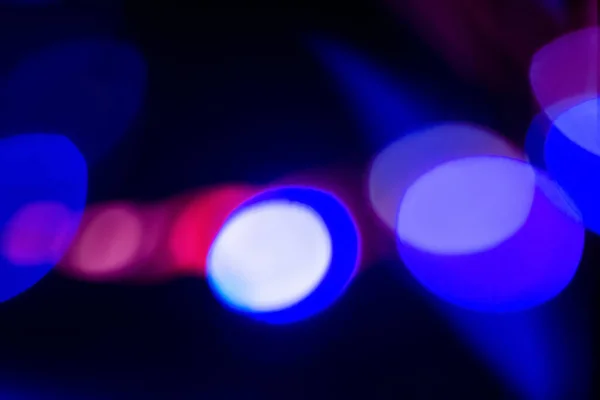 Fluorescerende achtergrond bokeh licht wazig neon blauw — Stockfoto