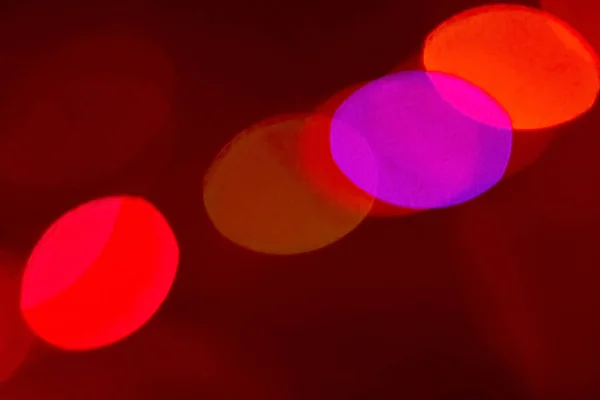 Colorful festive background neon bokeh light red — Stock Photo, Image