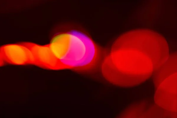 Fondo abstracto colorido luz bokeh rojo neón — Foto de Stock