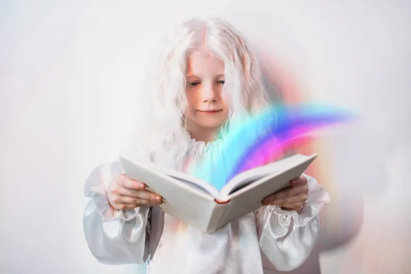 child imagination story time girl rainbow book