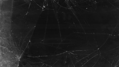 Kırık cam dokusunu kaplayan çatlak siyah lekeler