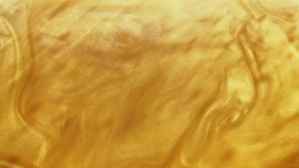Błyszczący przepływ farby stopionego złota animacja żółty — Wideo stockowe