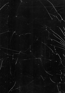 Kırık cam dokusunu kaplayan kırık çizikler.