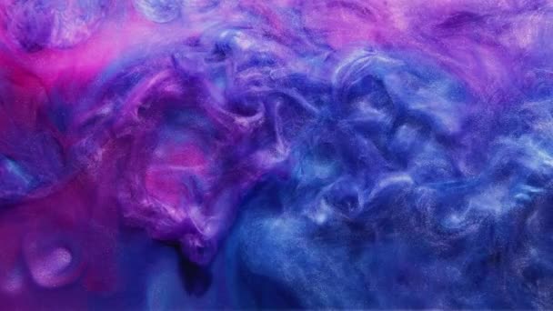 Χρώμα μίξη μελάνι πιτσιλίσματος στο νερό μπλε ματζέντα ροζ — Αρχείο Βίντεο