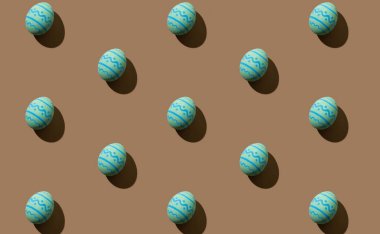 Paskalya arkaplanı şenlik desenli mavi yumurtalar kahverengi