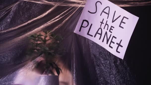 Save planet defocused volunteer plant film banner — Stock Video