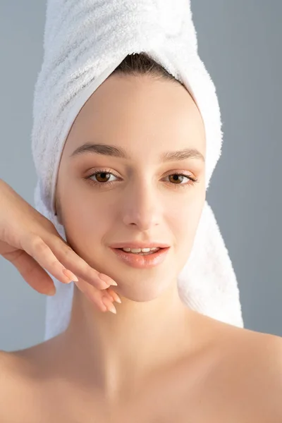 beauty care facial treatment woman touching skin