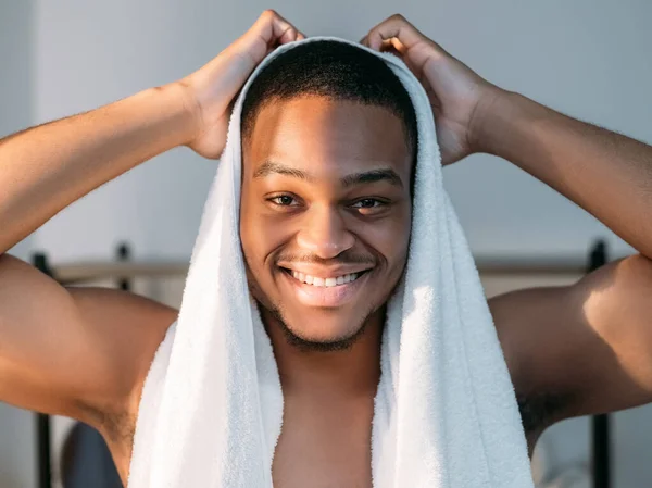 man hygiene skin care african drying hair towel