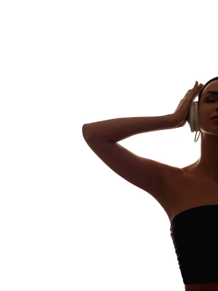 Vrouw silhouet muziek inspiratie in hoofdtelefoon — Stockfoto