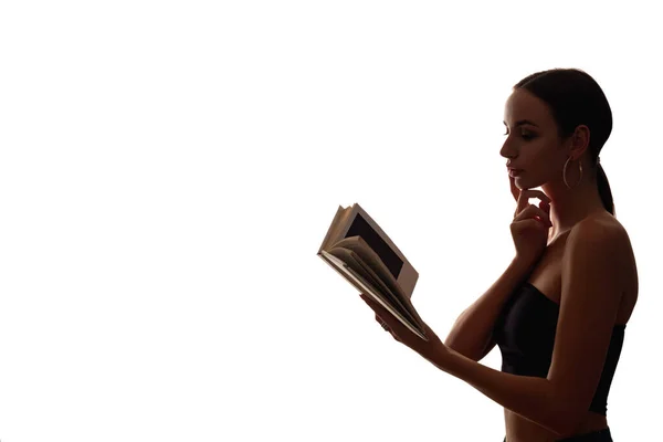 Female silhouette reading novel with open book — Stock Photo, Image